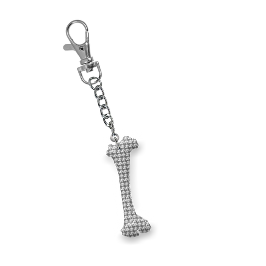A bedazzled chicken bone keychain charm from Ashnikko.